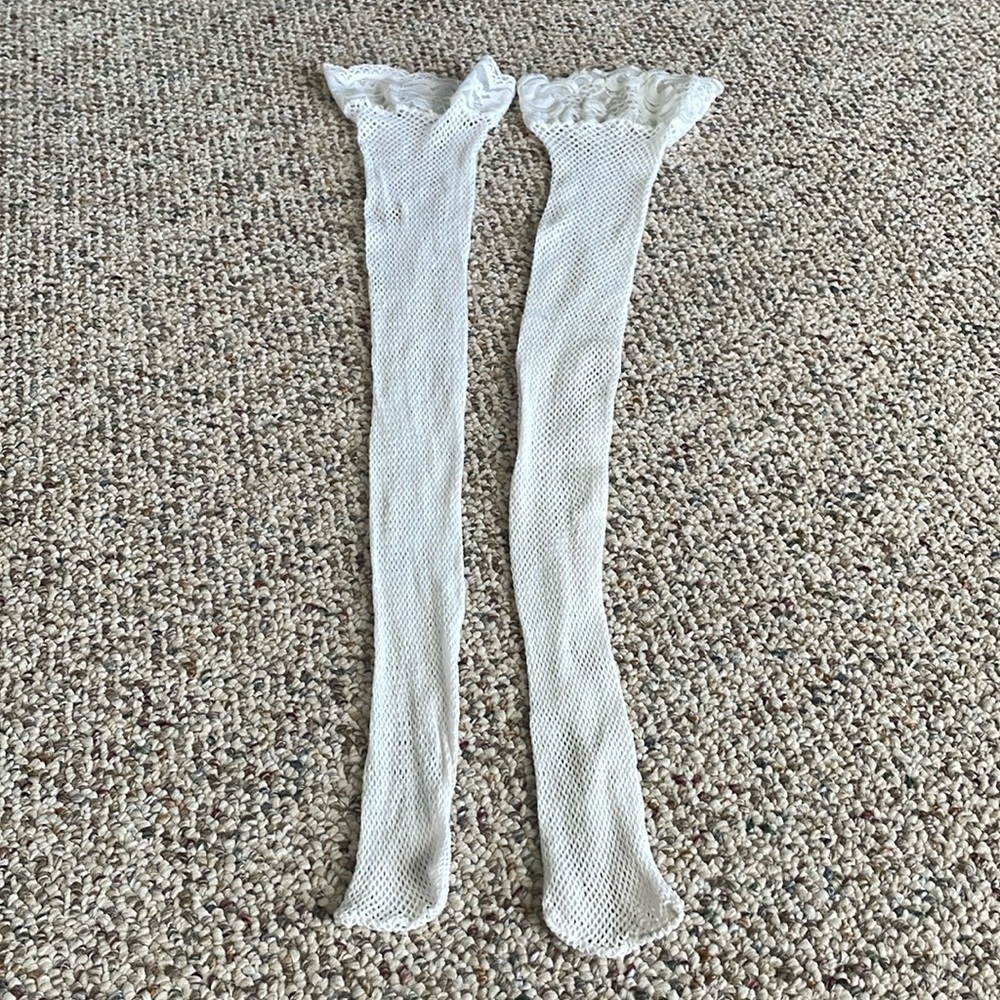 Pair Of Mismatched Fishnet Thigh High’s